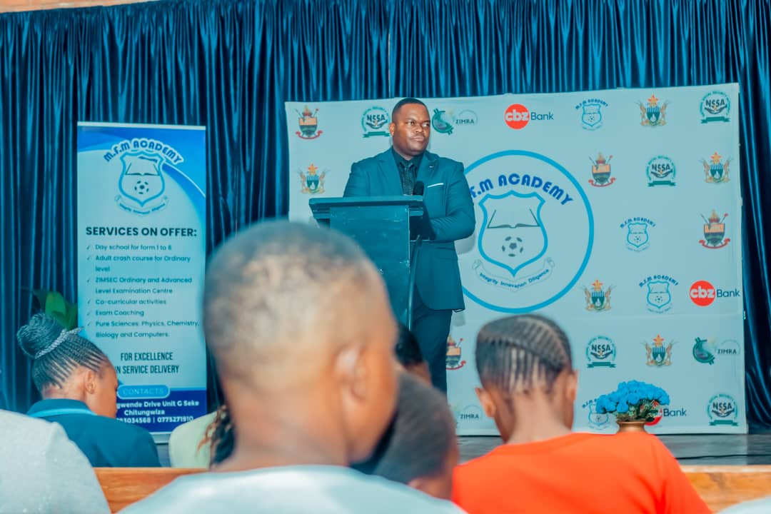 MFM Academy — Speaker addressing families in the hall