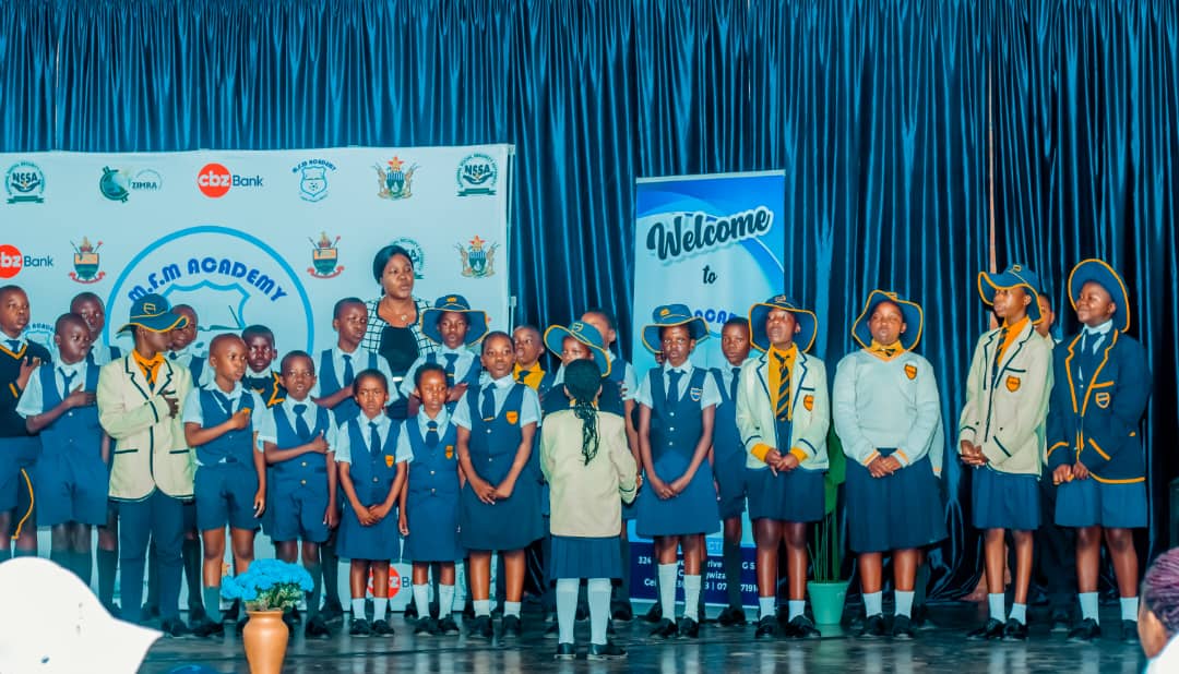 MFM Academy — School community celebrating on stage