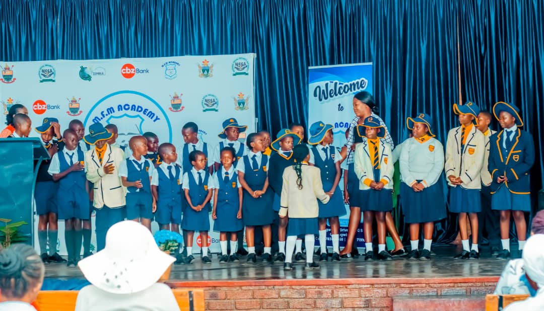 MFM Academy — Learners celebrating together on stage