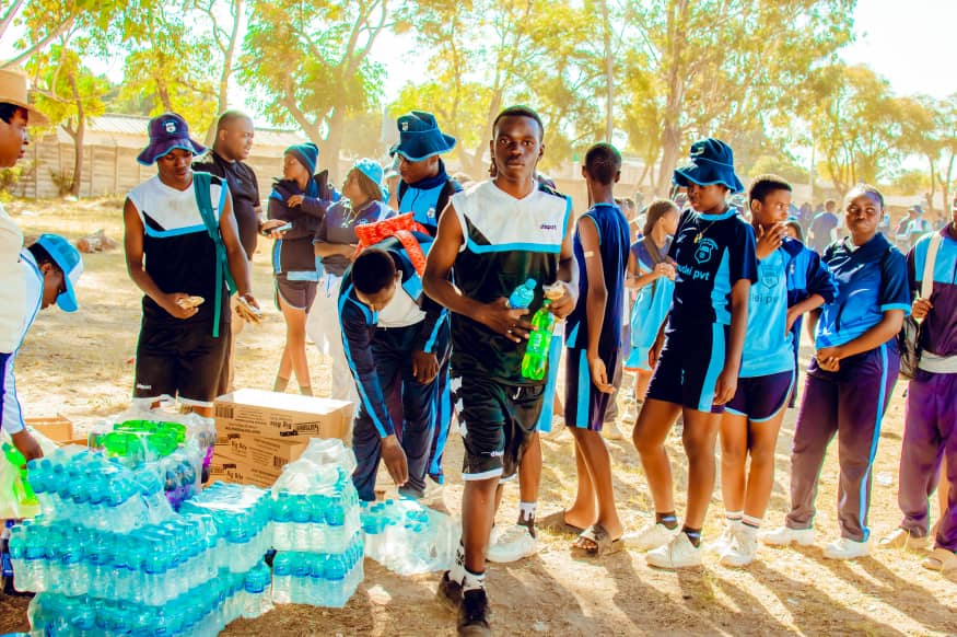 MFM Academy — Learners collecting refreshments at sports day