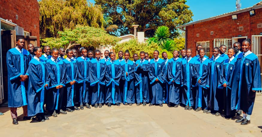 MFM Academy — School choir posing outside