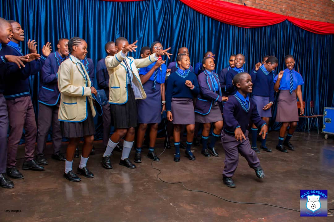 Choir members dancing during a performance